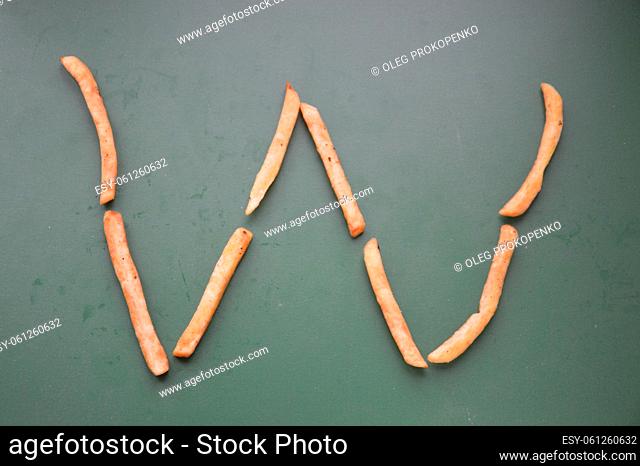 Letters of the english alphabet laid out from french the fries