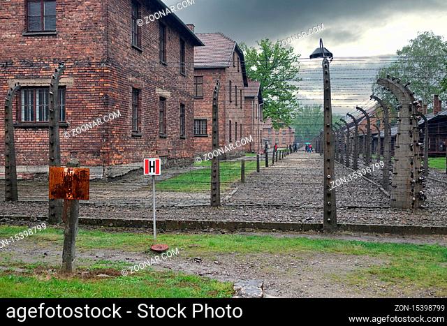 Oswiecim, Auschwitz, Poland - May 15, 2019: Buildings of concentration camp Auschwitz surrounded bij barbwire