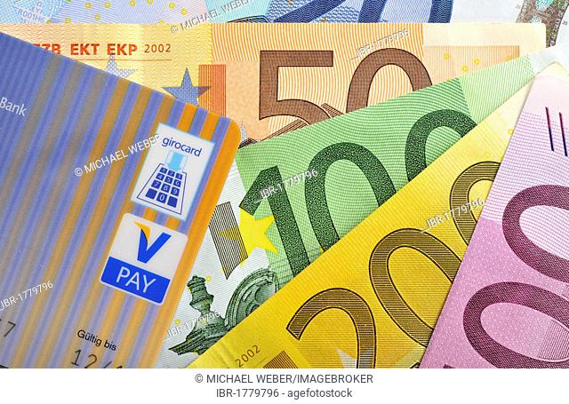 Euro banknotes, bills fanned out, bank card, cash card with the latest icons, V-PAY, VPAY, girocard