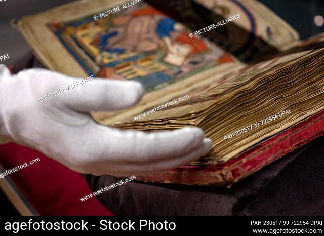17 May 2023, Rhineland-Palatinate, Trier: The Ada Gospels are kept in the treasury of the Trier City Library. It forms the leading manuscript of Charlemagne's...