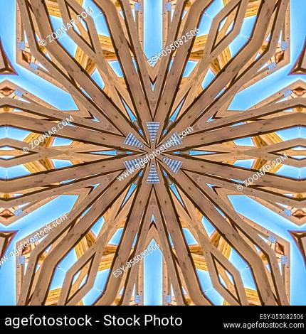 Design made from construction beams in home. Geometric kaleidoscope pattern on mirrored axis of symmetry reflection. Colorful shapes as a wallpaper for...