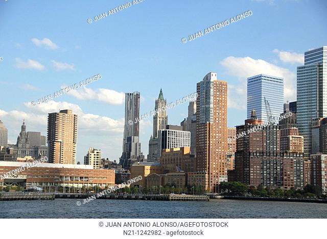 Battery Park City  from the Hudson River. Beyond, we can see, from left to right, the Municipal Building, the Beekman Tower