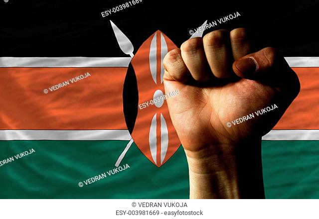 Hard fist in front of kenya flag symbolizing power