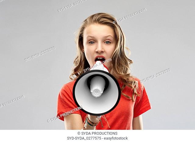 angry teenage girl speaking to megaphone
