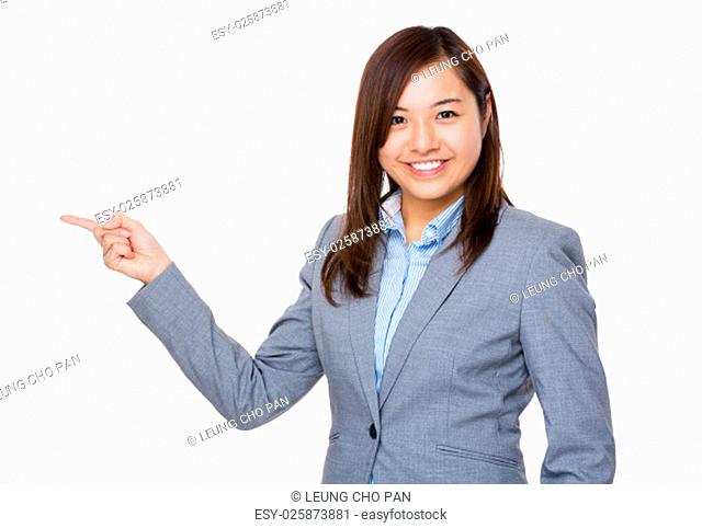 Asian Young businesswoman showing finger point aside