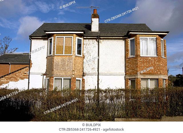 Derelict semi detached Council houses waiting demolition, East London, England, UK