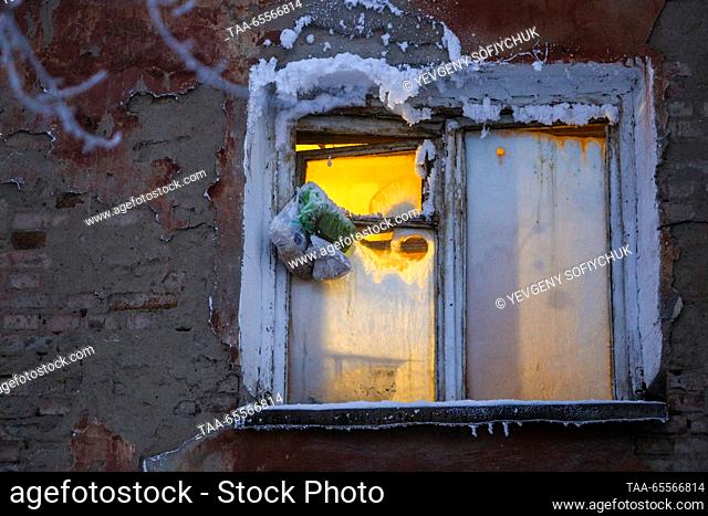 RUSSIA, OMSK - DECEMBER 8, 2023: A view of an ice-coated building in the Siberian city of Omsk on a frosty winter day. According to Russia's weather forecasting...