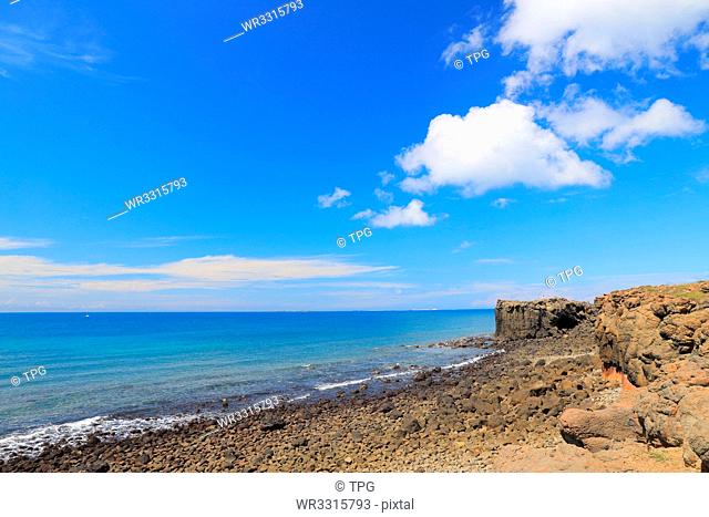 Blue ocean and sky with white cloud beside the coast;hale Cave;Xiaomenyu;Penghu;Taiwan