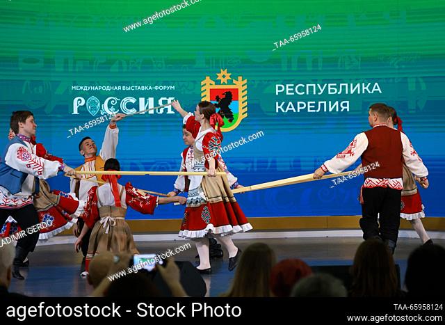 RUSSIA, MOSCOW - DECEMBER 21, 2023: Members of a dance ensemble perform at the opening of Karelia Republic Day at the Russia Expo international exhibition and...
