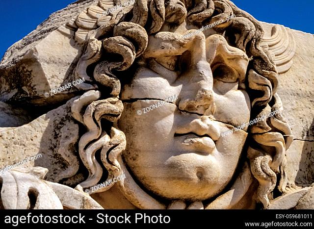 Beautiful face carved on marble in classical style by ancient Greeks at the Temple of Apollo in Didyma. An impressive sanctuary near the famous Hellenic city of...