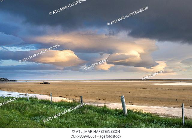 View of storm clouds and beach, Raudasandur, west fjords, Snaefellsnes, Iceland