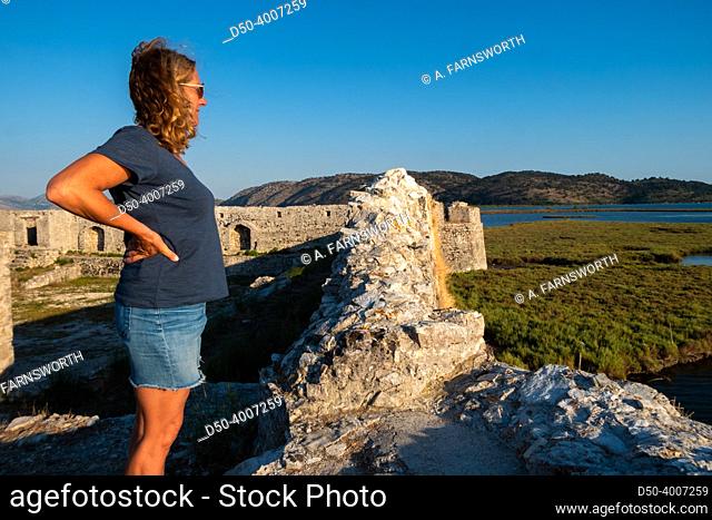 Ksamil, Albania A woman tourist visits the Ali Pasha Ottoman castle at the inlet of Lake Butrint