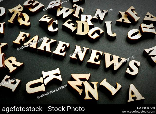 Fake news concept. Letters on the black desk