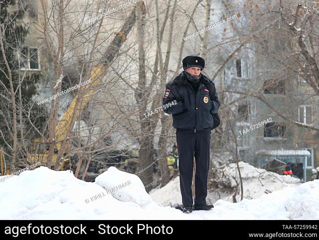 RUSSIA, NOVOSIBIRSK - FEBRUARY 9, 2023: A police officer guards the area outside a five storey apartment building where a gas explosion occurred