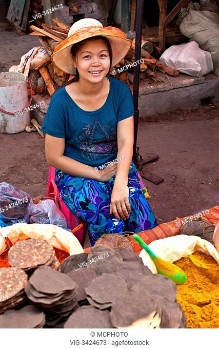 A young girl selling tortillas at the CENTRAL MARKET in KENGTUNG also known as KYAINGTONG - MYANMAR - 29/04/2012