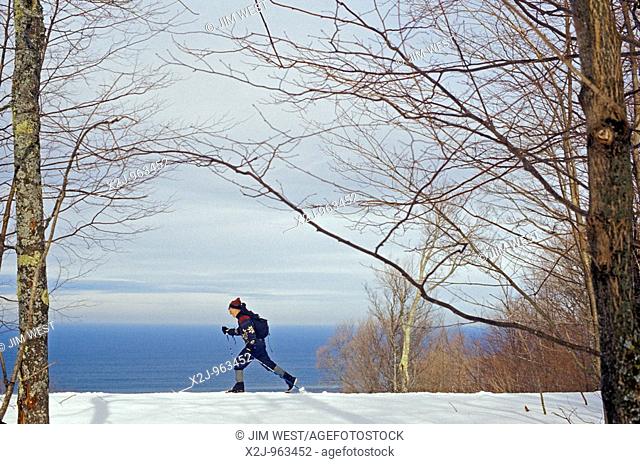 Porcupine Mountains State Park, Michigan - Fred Fechheimer, 65, skis along a ridge above Lake Superior while on a winter camping trip in the Porcupine Mountains