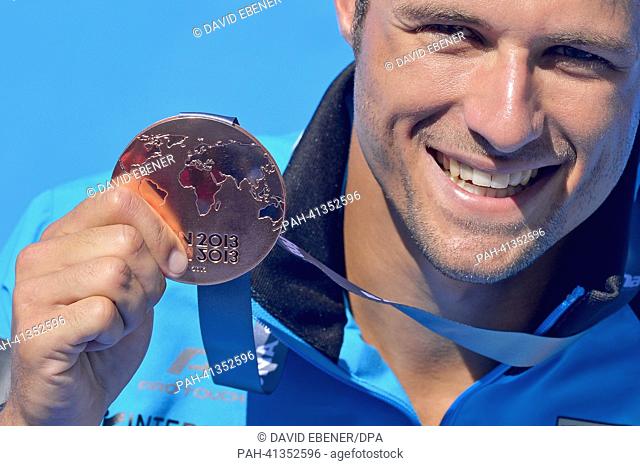 Bronze medalist Sascha Klein of Germany celebrates after the men's 10m Platform diving final of the 15th FINA Swimming World Championships at Montjuic Municipal...