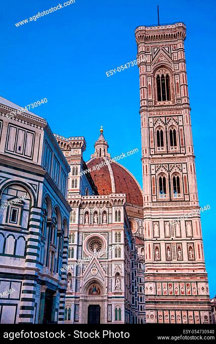 The dusk falls over the Baptistery of St. John, Giotto Campanile and Florence Cathedral consecrated in 1436