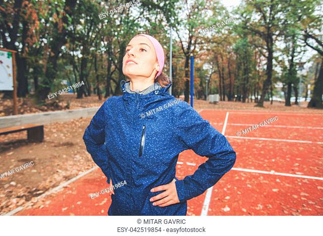Fitness woman doing workout at park. Sporty girl practicing in autumn morning