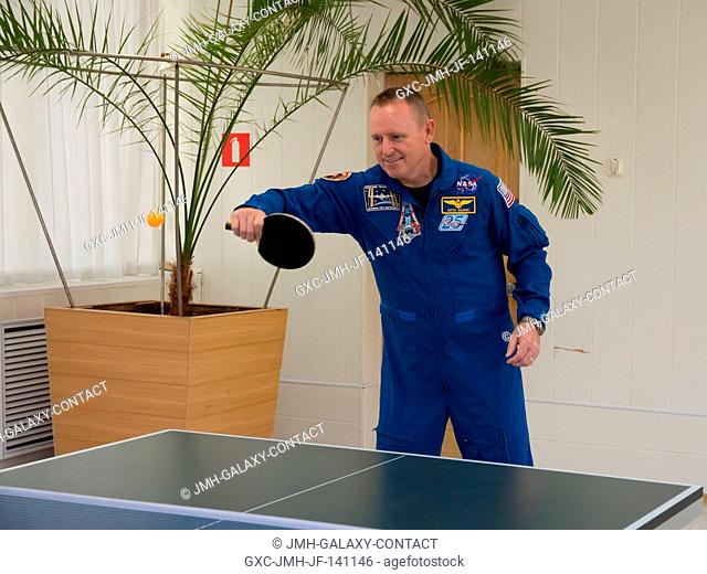 At the Cosmonaut Hotel crew quarters in Baikonur, Kazakhstan, Expedition 41 Flight Engineer Barry Wilmore of NASA tries his hand at a game of table tennis Sept