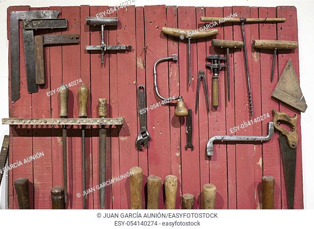 Old hand tools used at Wine industry for barrel-making. Selective focus