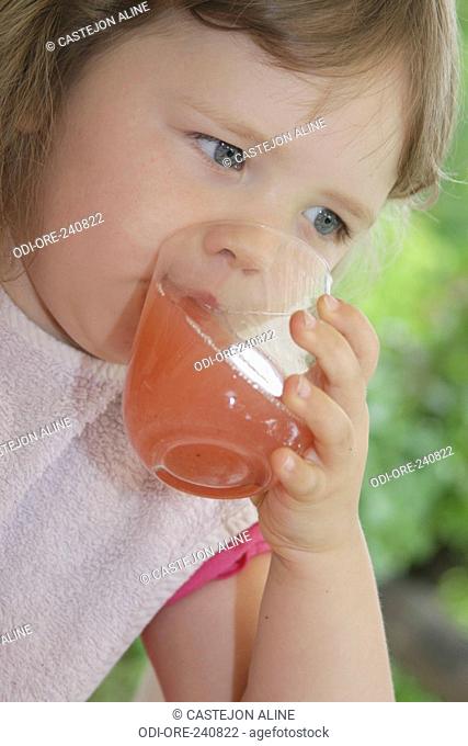 Little girl fruit juice