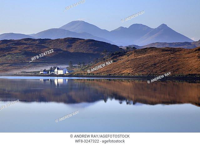 The mountains on North Harris reflected in Loch Ceann Hulabhaig on the Isle of Lewis. The image was captured from near Callanish III stone circle on a misty...