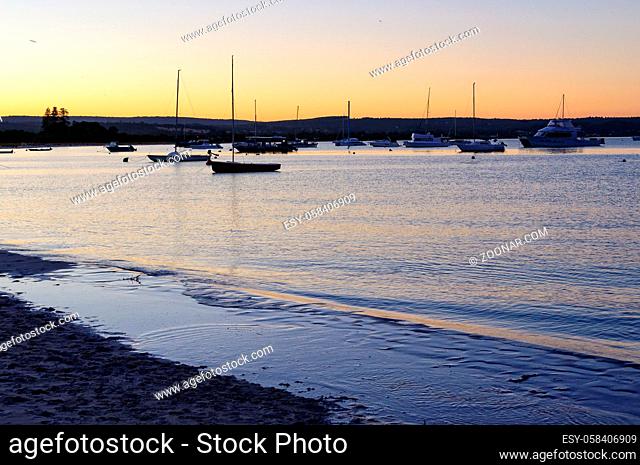 Yachts anchored in the bay at twilight - Dunsbrough, WA, Australia