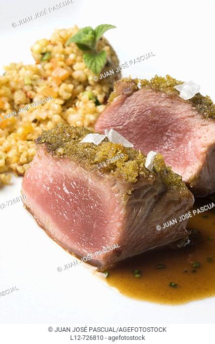 Lamb loin with aromatic herbs and grain couscous at restaurant A Estacion by chefs  Xoan Crujeiras and Beatriz Sotelo, Cambre