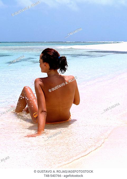 Woman on beach, Los Roques. Venezuela