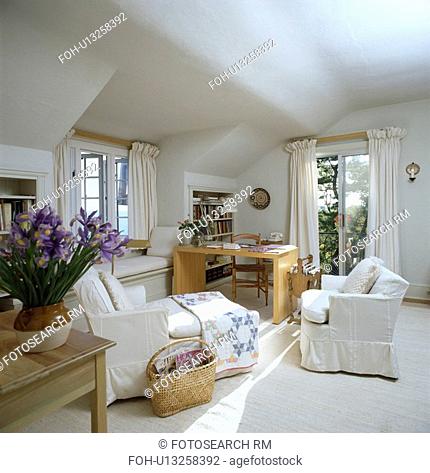 White chaiselongue and sofa in white attic traditional living room
