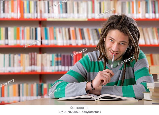 Young student in the library, studying