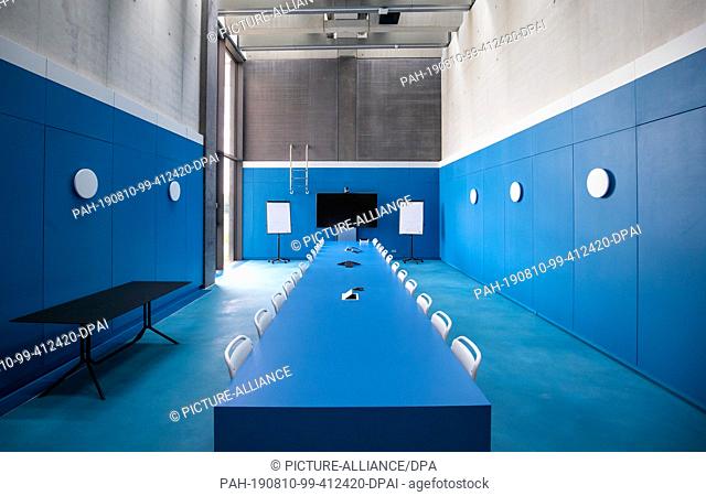 09 August 2019, Bavaria, Herzogenaurach: View into a meeting room designed as a swimming pool in a new office building of the sports equipment manufacturer...