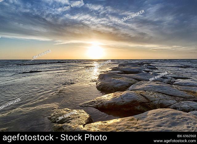 Sunset over the sea, groyne of chalk cliffs, Punta Grande, Realmonte, Sicily, Italy, Europe