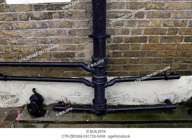 Cast Iron drainpipes and guttering on a Victorian building, London, UK