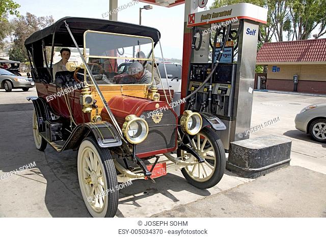 Antique car at modern gas station in Santa Paula, CA