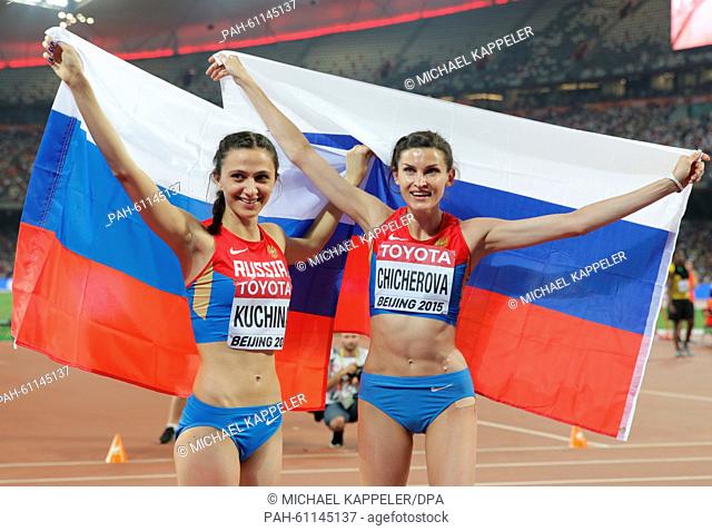 Gold medalist Maria Kuchina (L) of Russia and bronze medalist Anna Chicherova of Russia celebrate after the women's High Jump final of the Beijing 2015 IAAF...