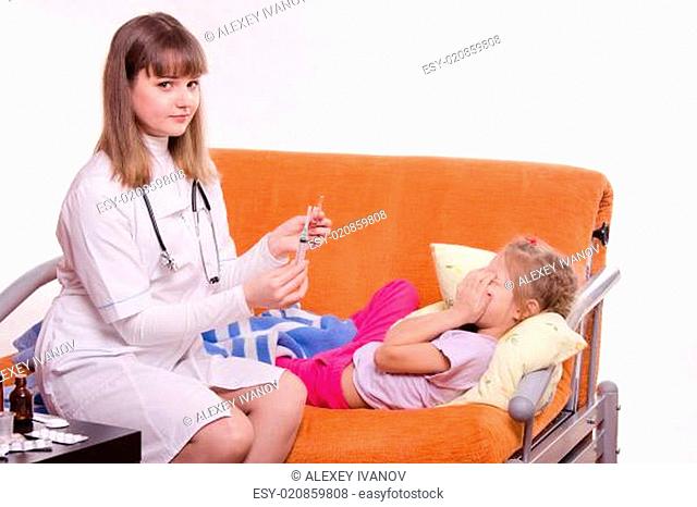 Doctor getting ready to make a little girl an injection