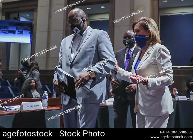 Speaker of the House Nancy Pelosi (R) arrives with George Floydís brother Philonise Floyd (L) at the House Judiciary Committee hearing on ëPolicing Practices...