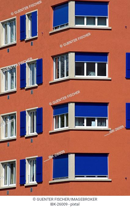 Renovated house with blue shutters Geneva Switzerland