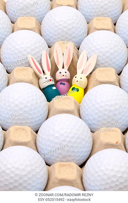 White golf balls in the box for eggs and Easter decoration