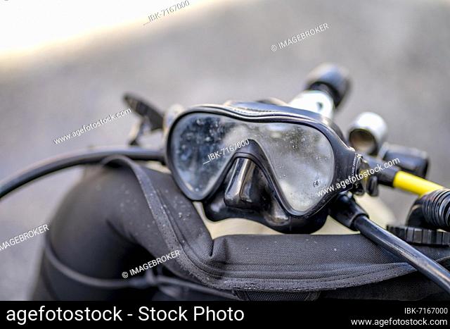 Goggles and oxygen tank with regulator for scuba divers, Spain, Europe
