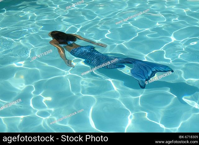 Mermaid, fins, girl in pool, swimming, diving, in water, italy