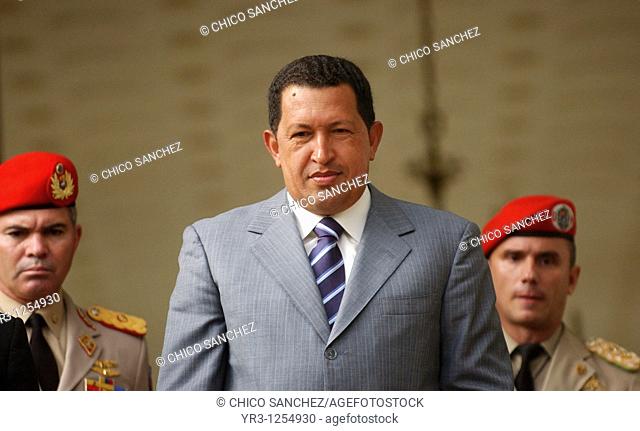 Venezuela's President Hugo Chavez salutes to journalists in Miraflores Palace in Caracas, Venezuela