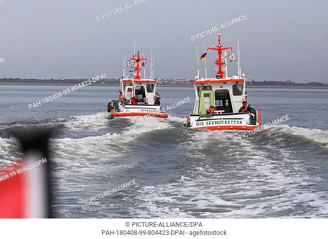 08 April 2018, Germany, Wangerooge: After the launching ceremony of the new marine rescue boat 'FRITZ THIEME' (l), special guests are taken on a tour off the...