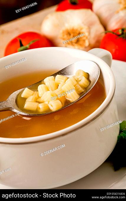 photo of delicious hot noodles soup on wooden table
