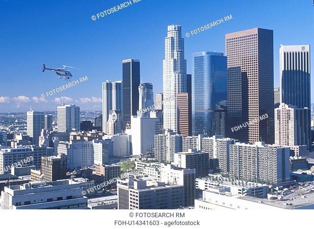 Helicopter flies over new Los Angeles skyline, Los Angeles, California