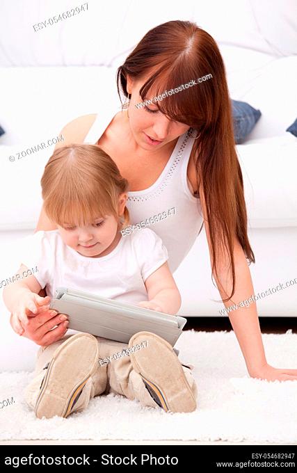 Mother and daughter using a tablet pc