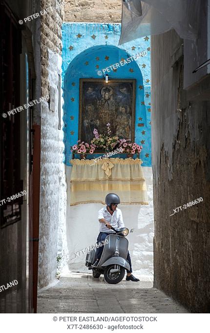 A typical street shrine in a side alley in Barivecchia, Bari old town, Puglia, Southern Italy