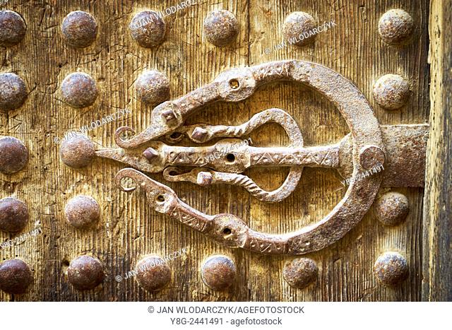 Fez. Detail of the old wooden door in Medina. Iron ferrule symbol of the hand of Fatima. Morocco